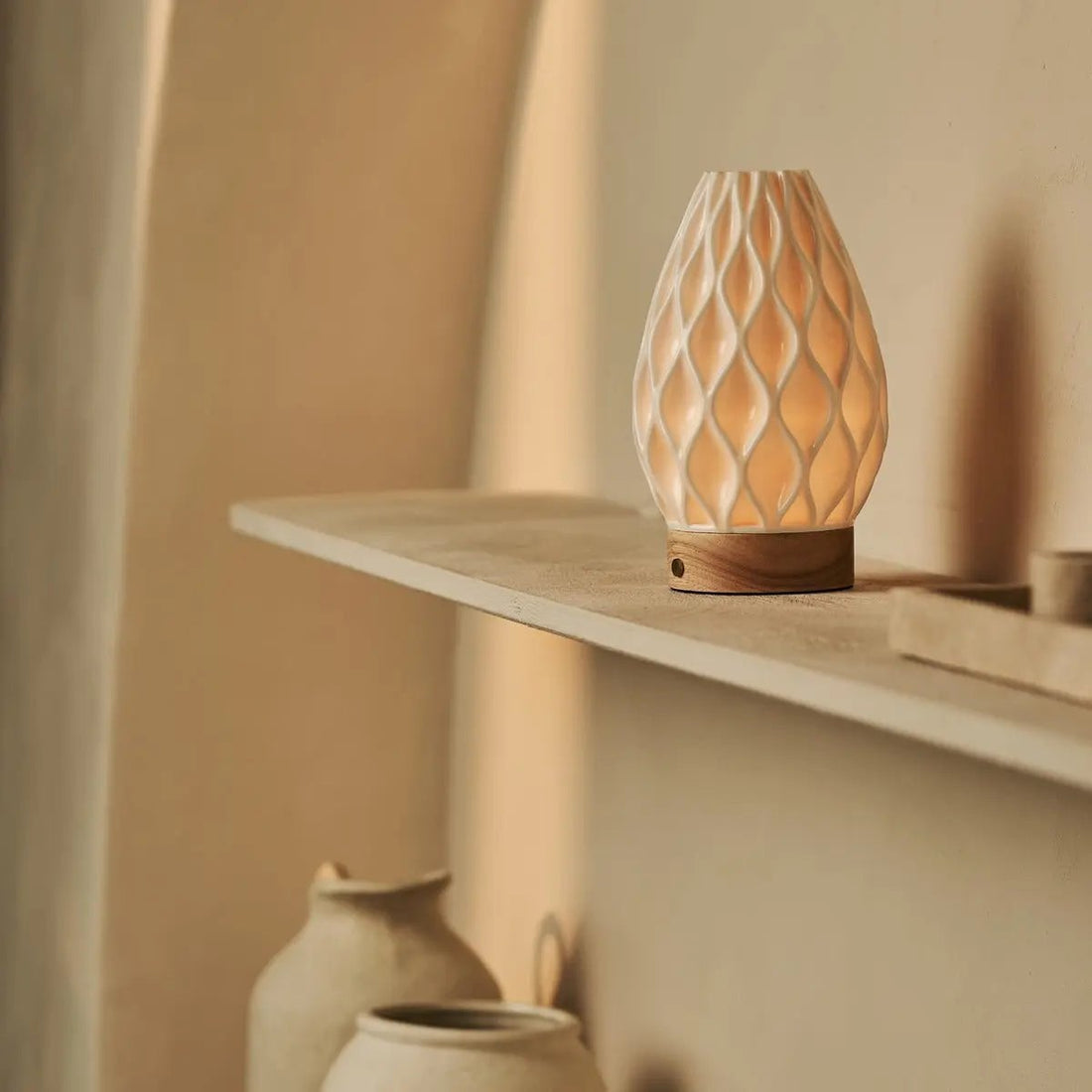 Minimal cordless table lamp on a side table in a calm, understated interior