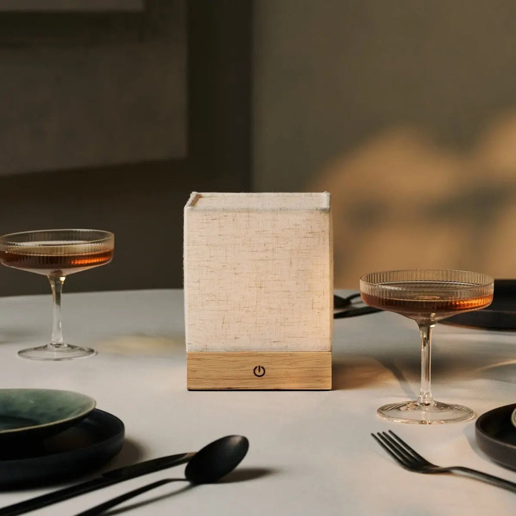 Zano cordless lamp side view showing rubberwood base and linen shade