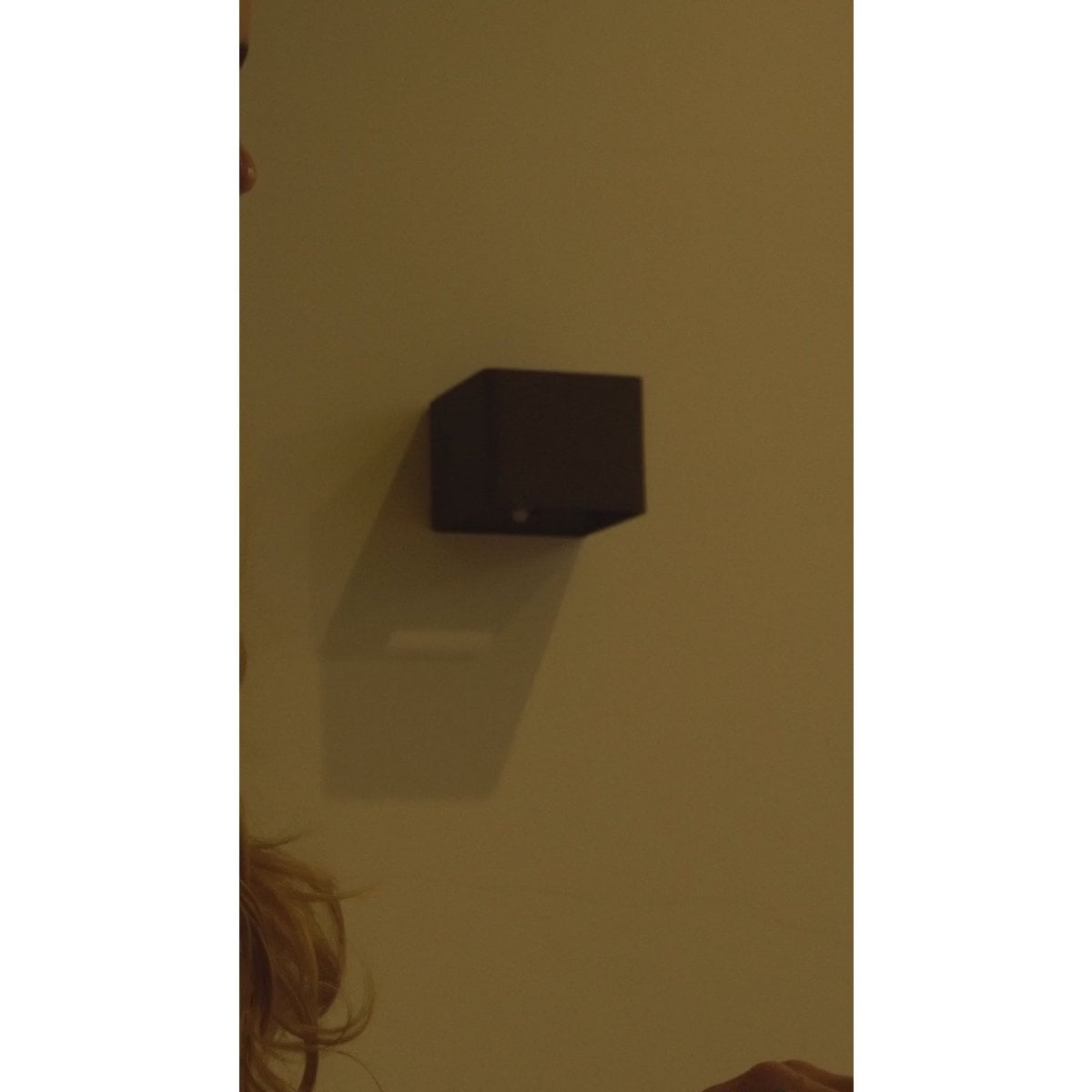 Tess magnetic mount rechargeable wall light in hallway