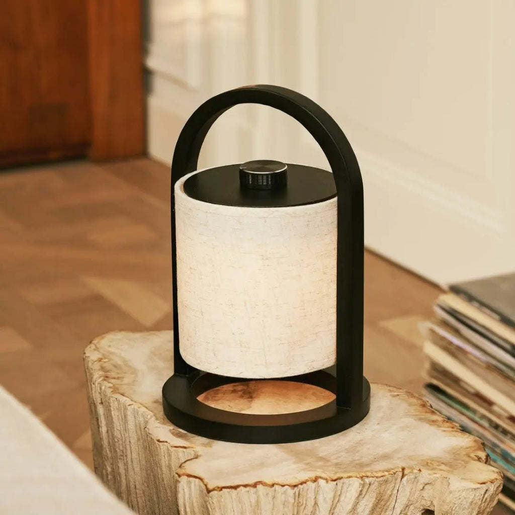 River cordless lamp side view showing black rubberwood and linen shade