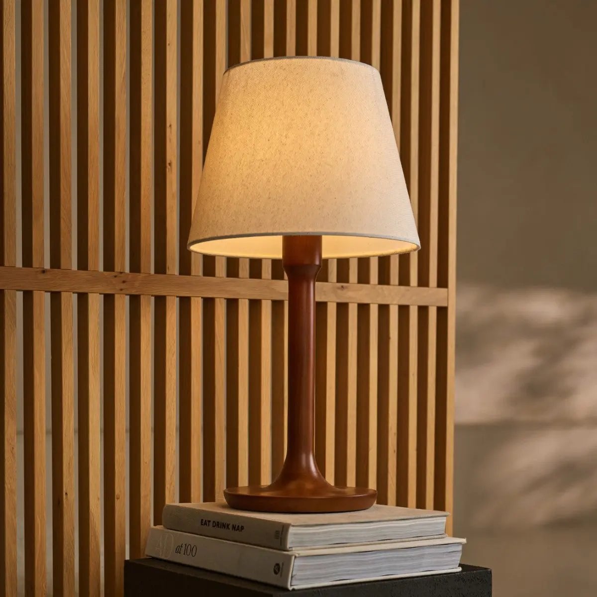 Ovaro corded lamp side view showing chestnut wood and fabric shade