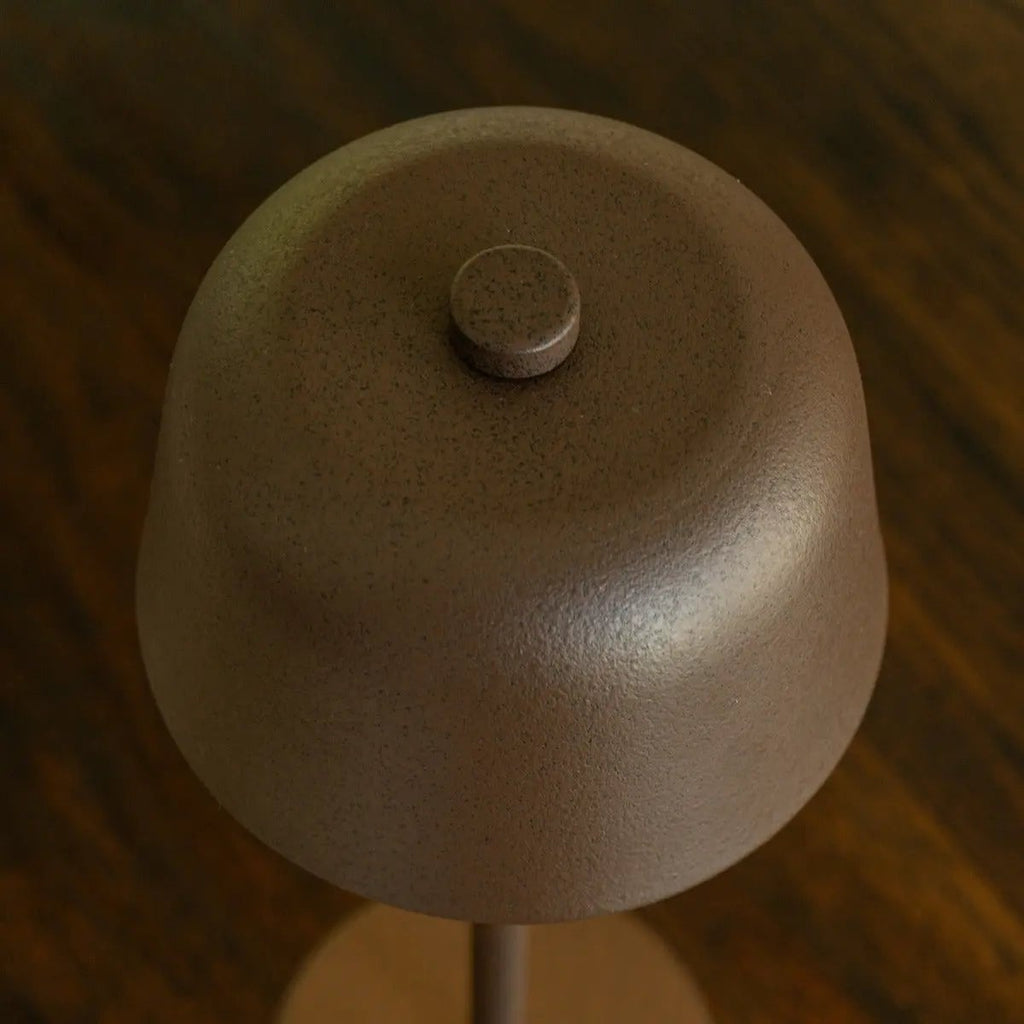 Anton cordless lamp on dining table in ambient light mode