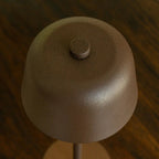 Anton cordless lamp on dining table in ambient light mode