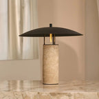 Nicolaas travertine lamp in desk workspace setting
