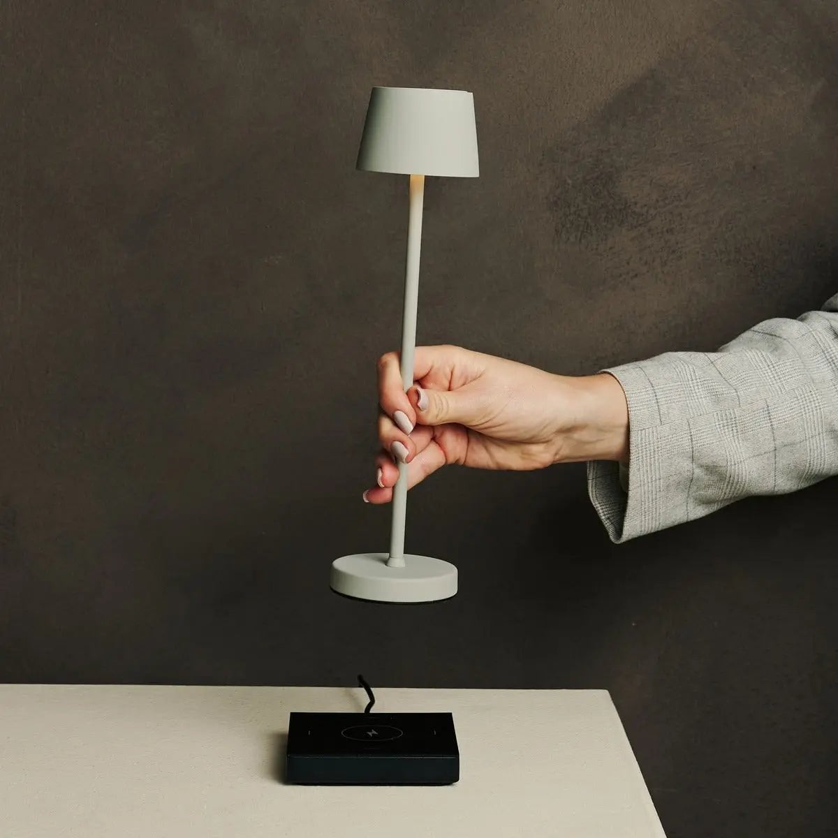 Vondel cordless lamp glowing warm ambient light on table