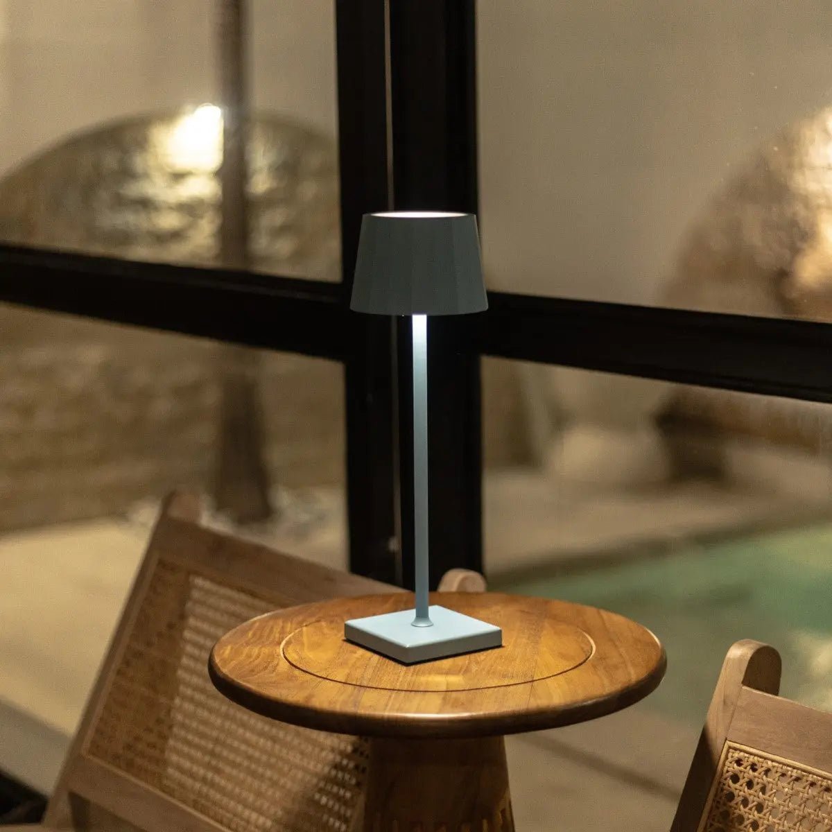 Cael rechargeable lamp warm ambient glow on bedside table