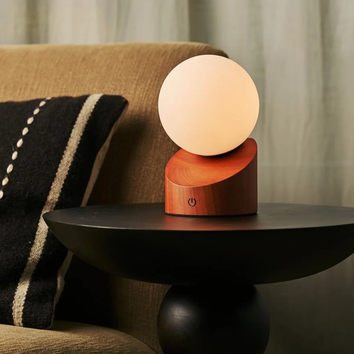 Morris cordless lamp side view showing rubberwood base and glass shade