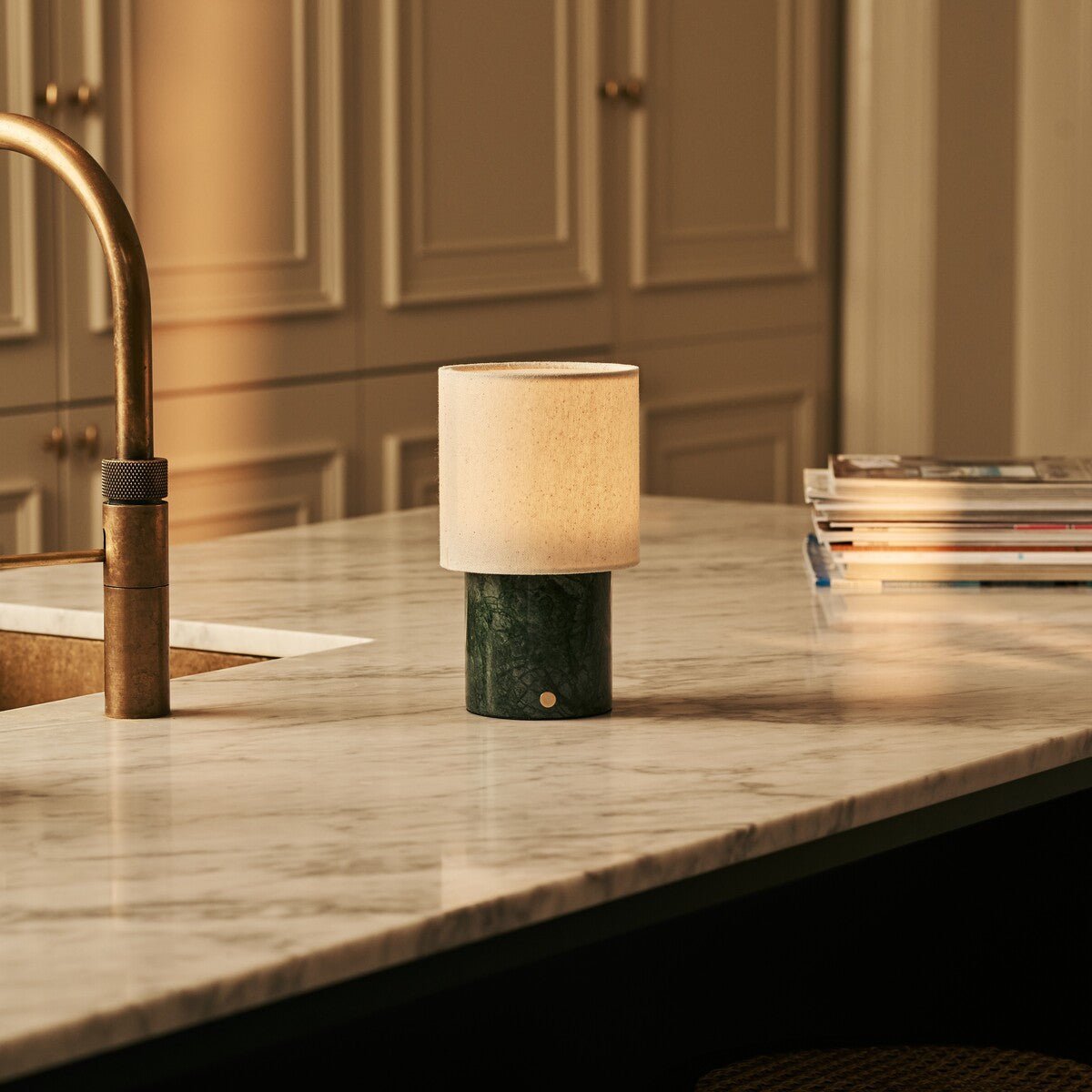 Dou marble lamp side view showing green stone base and linen shade