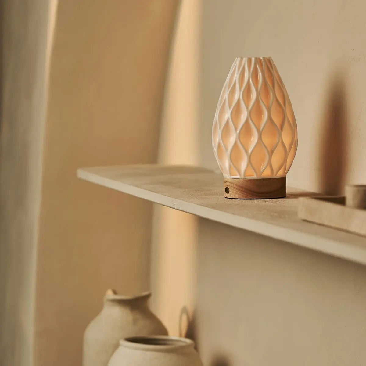 Virel wood lamp warm glow through porcelain in room setting