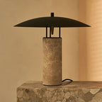 Nicolaas corded lamp side view showing travertine base and metal shade