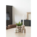 Bello brown stoneware taper candle holder curved design