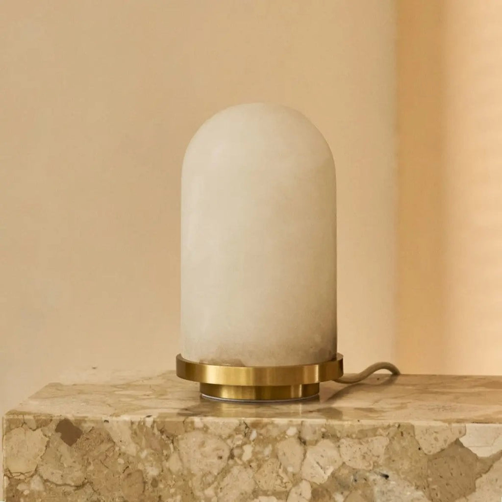 Mateo corded lamp side view showing gold base and oval alabaster shade