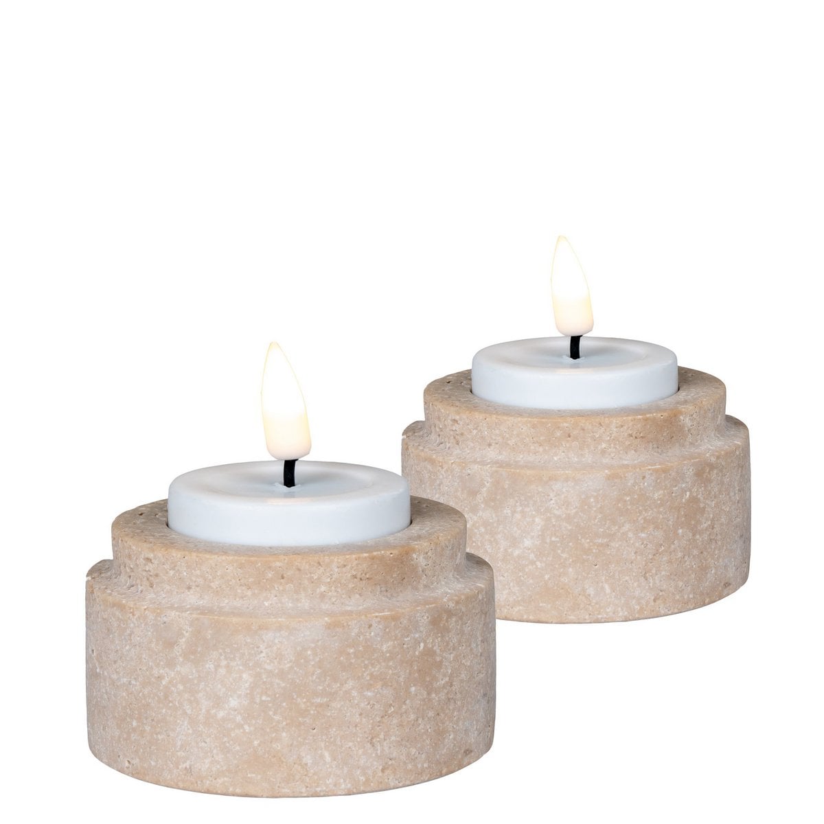 Luma travertine holders styled on shelf with tealights
