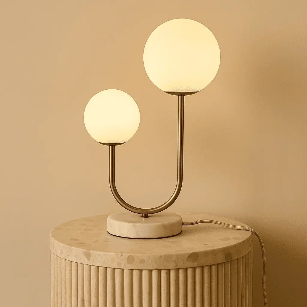 Aurion twin lamp side view showing marble base and gold stem