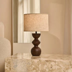 Kai dark wood lamp close-up of sand shade warm light