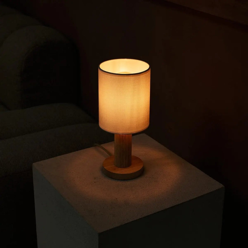 Boris table lamp warm ambient glow in living room