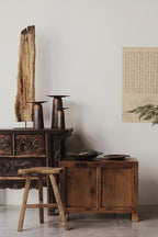 Decorative setting with wooden furniture and accessories