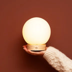 Flore compact lamp on bedside table