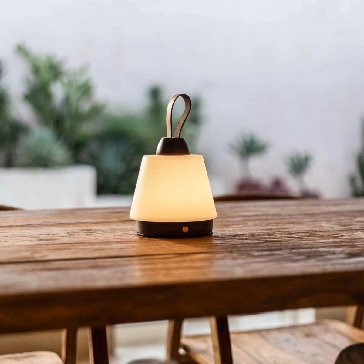 Amber cordless lamp side view showing rubberwood base and leather accent