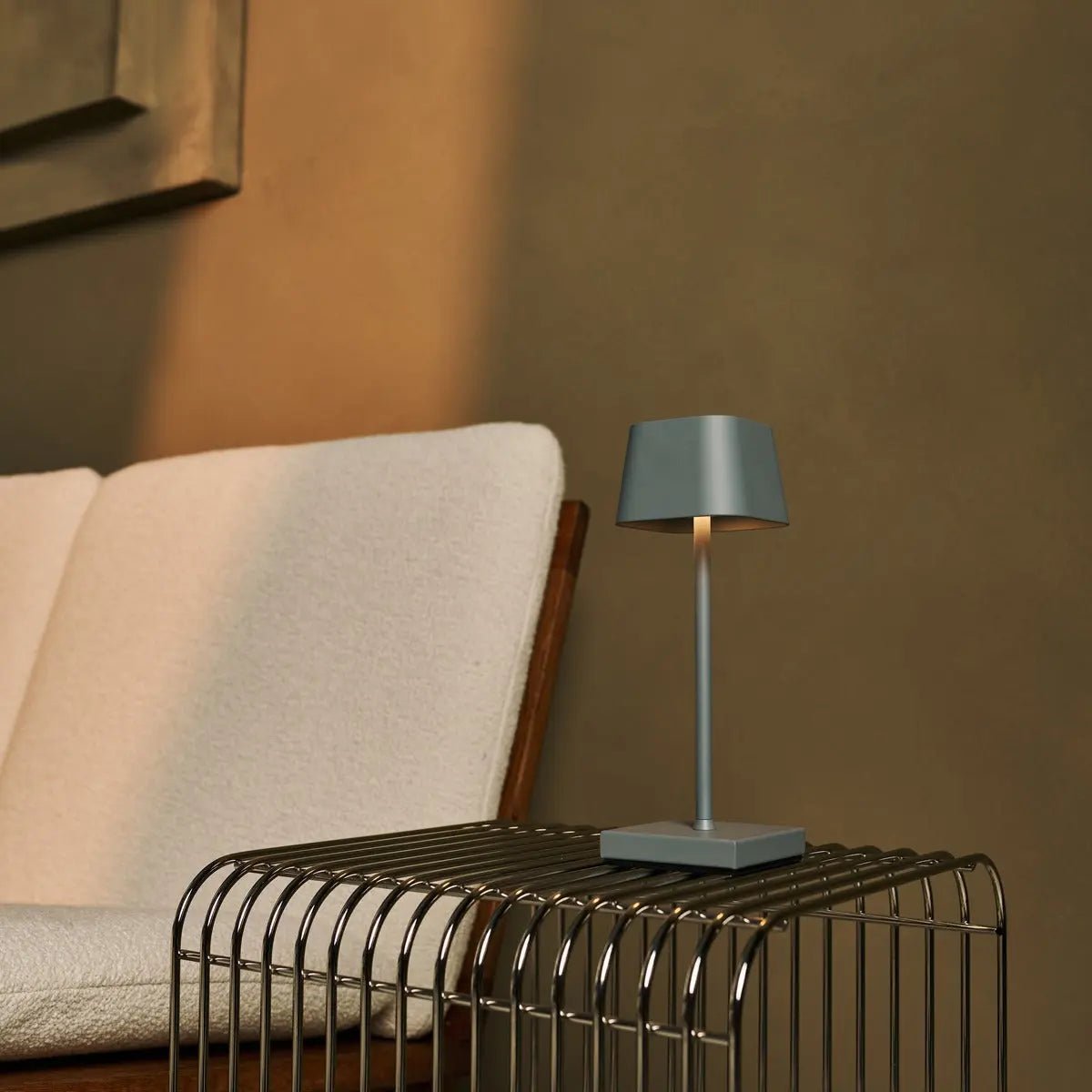 Sarphati mouse grey metal lamp on hotel console table