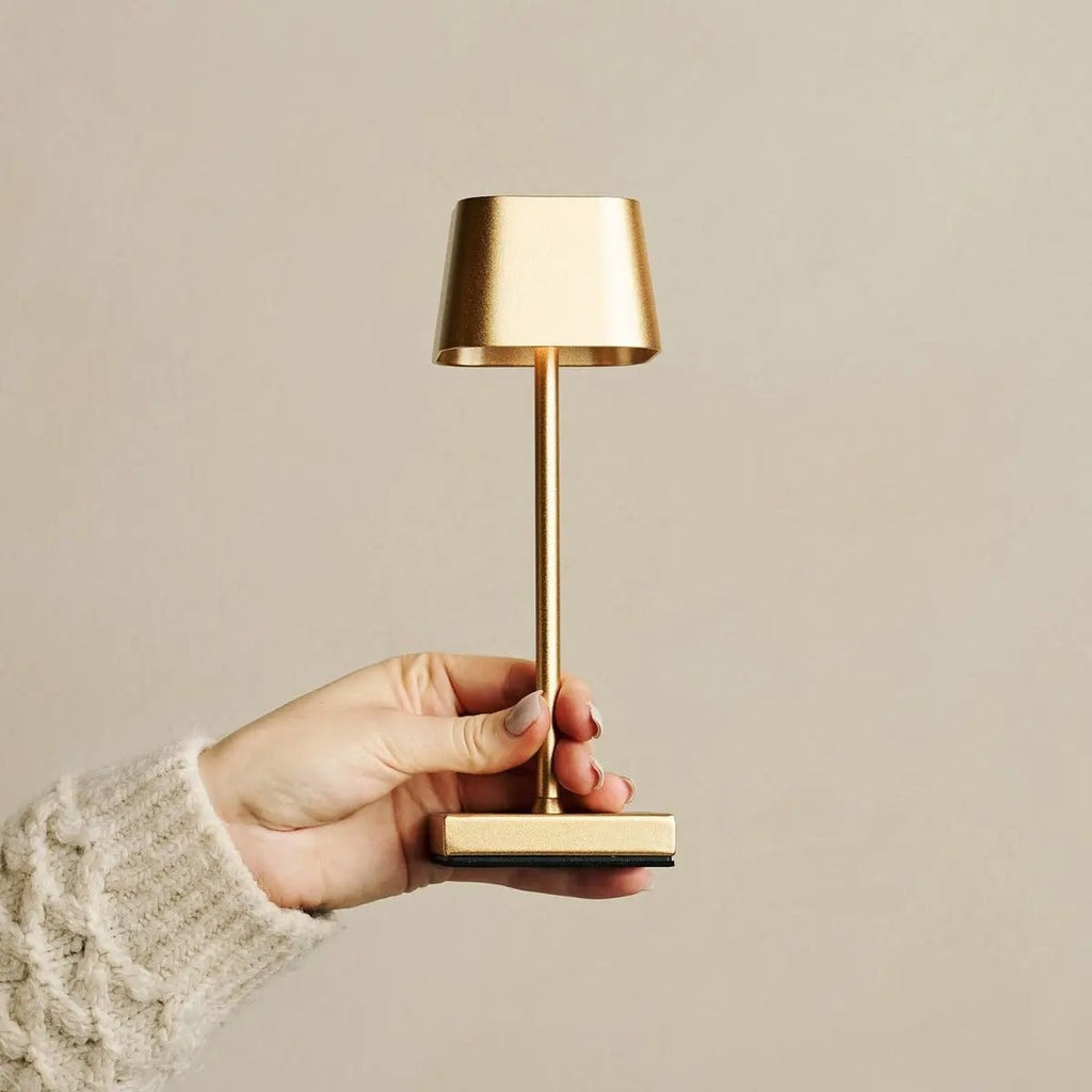 Sarphati gold lamp close-up of metal finish and touch base