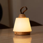 Liv cordless lamp side view showing rubberwood and leather detail