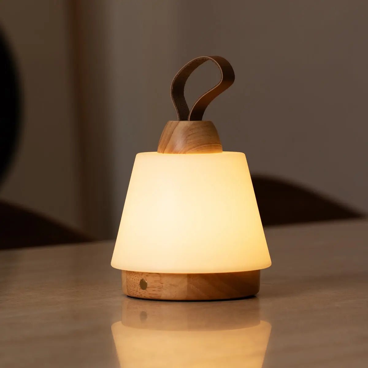 Liv cordless lamp side view showing rubberwood and leather detail