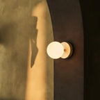 Richella rechargeable wall lamp side view showing rubberwood base