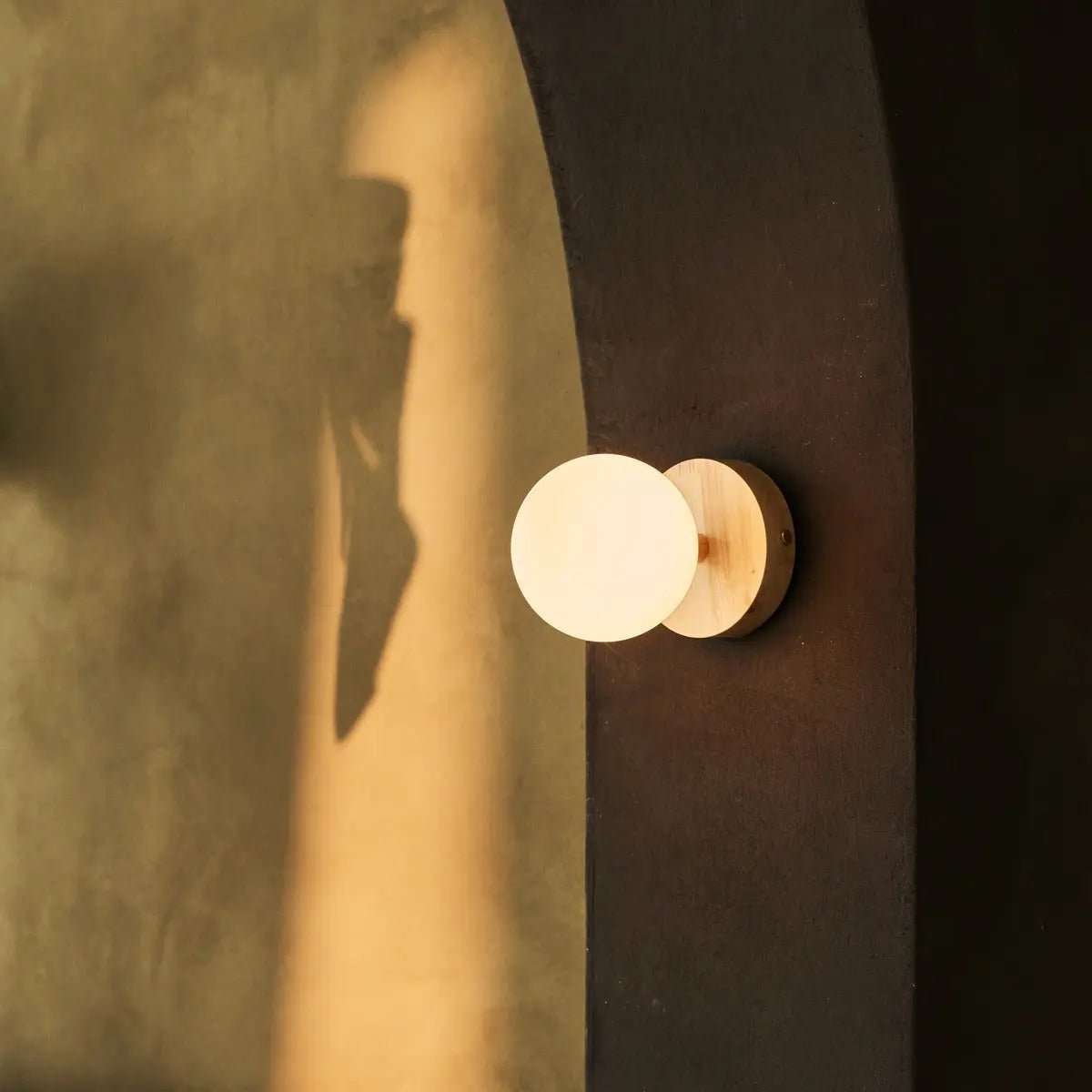 Richella rechargeable wall lamp side view showing rubberwood base