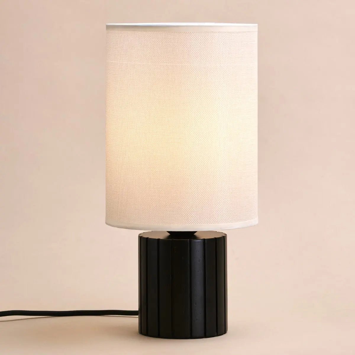 Kiko ribbed rubberwood lamp in modern interior