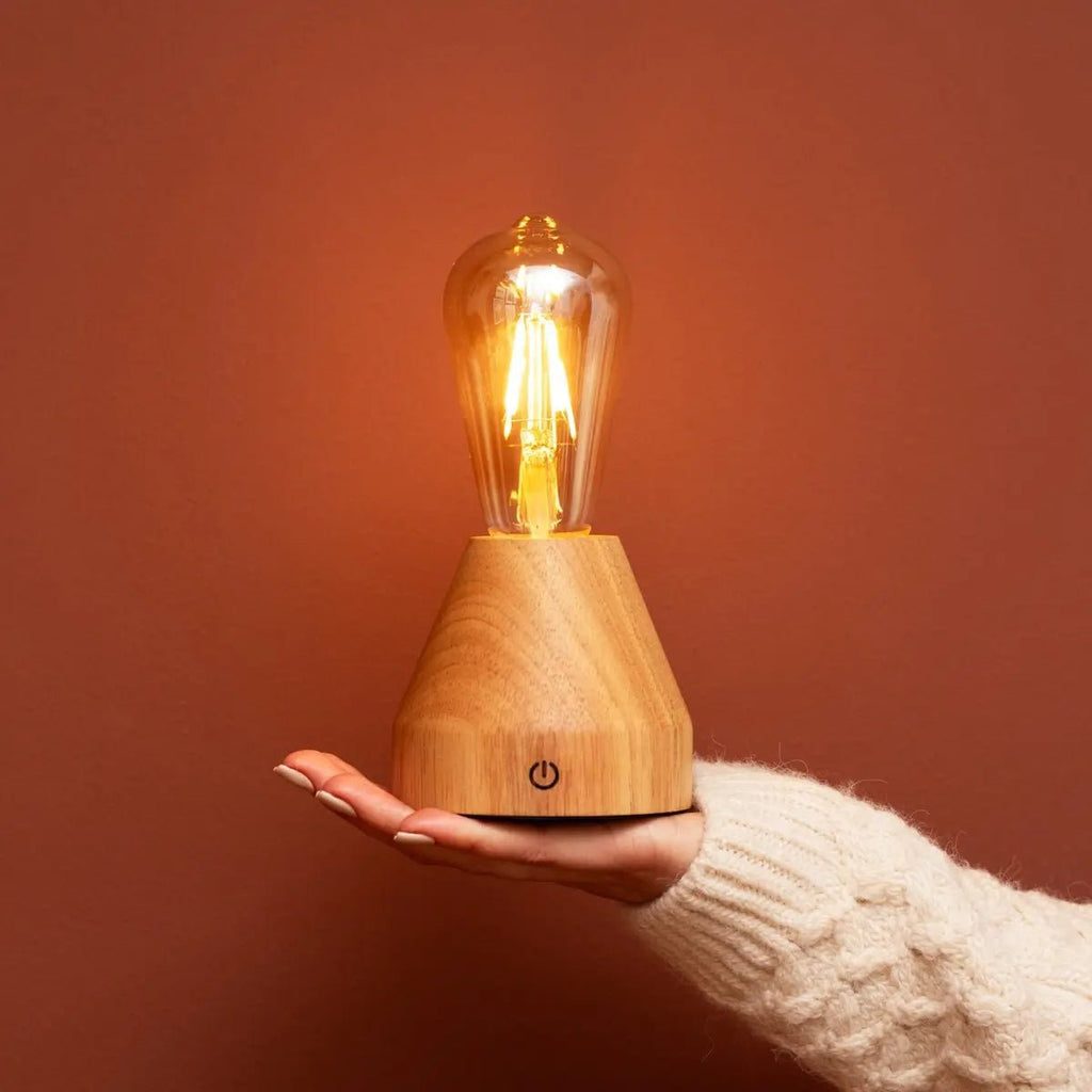 Zavi compact lamp on bedside table