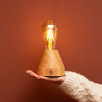 Zavi compact lamp on bedside table