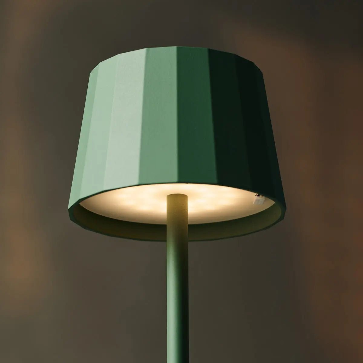 Mael metal lamp side view showing cylindrical sage green form