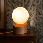 Quin corded lamp side view showing rubberwood base and glass shade