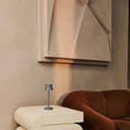De Pijp cordless lamp glowing warm ambient light on table