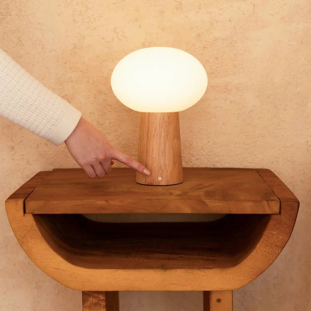 Max cordless lamp side view showing rubberwood and matte glass shade