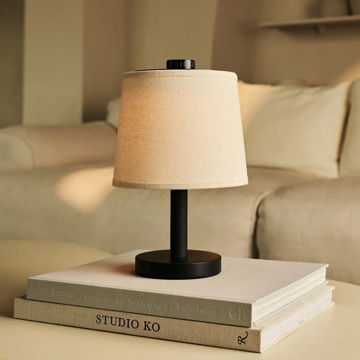 Rover table lamp detail of linen shade and black wood base