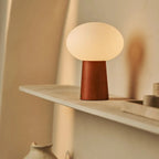 Max glass shade lamp in living room console setting