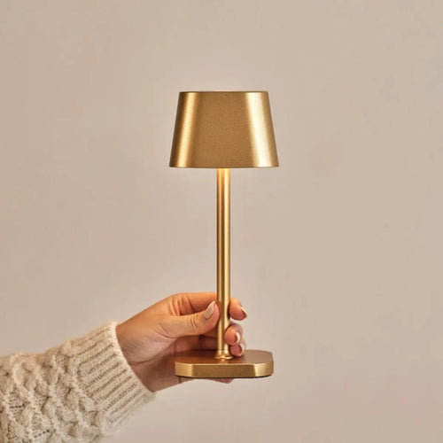 Ava metal lamp side view showing cylindrical gold form