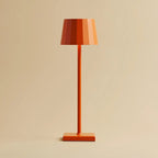 Wouter blossom orange metal lamp at full brightness