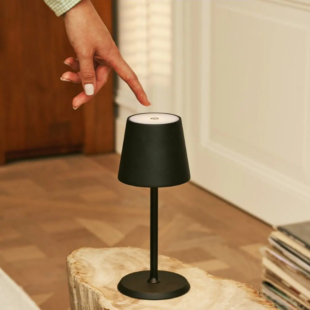 James rechargeable lamp warm ambient glow on bedside table