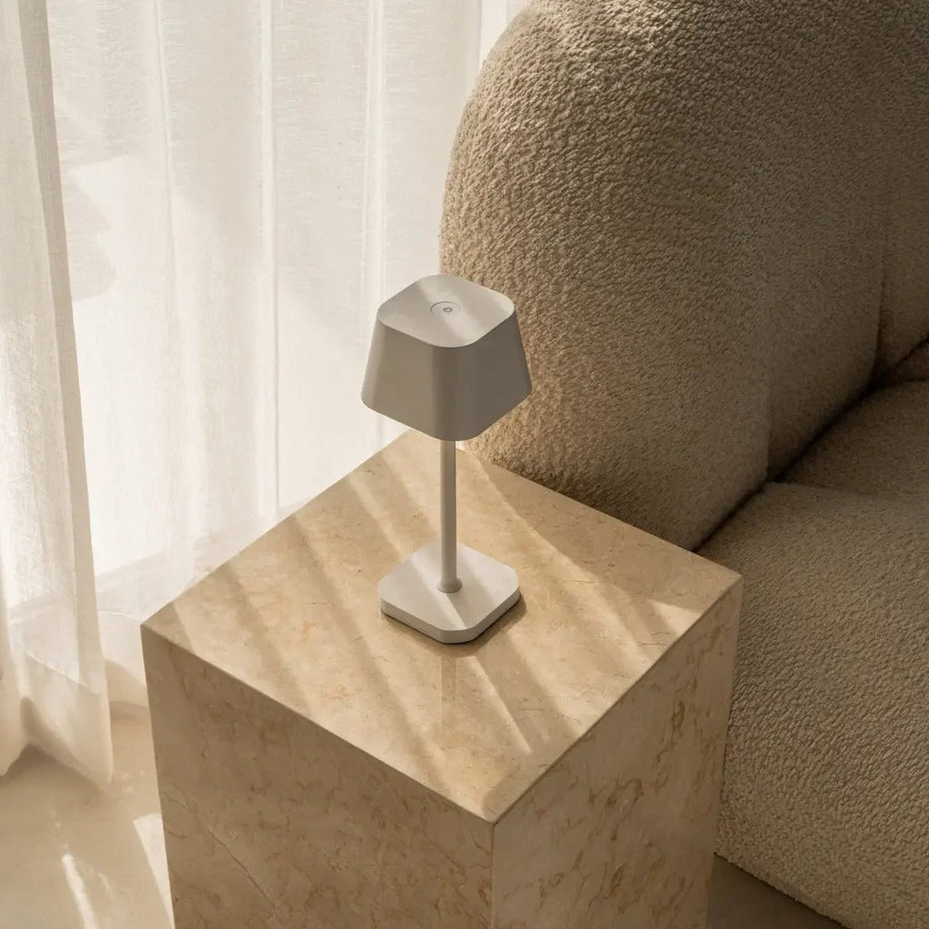 Ava rechargeable lamp warm ambient glow on bedside table