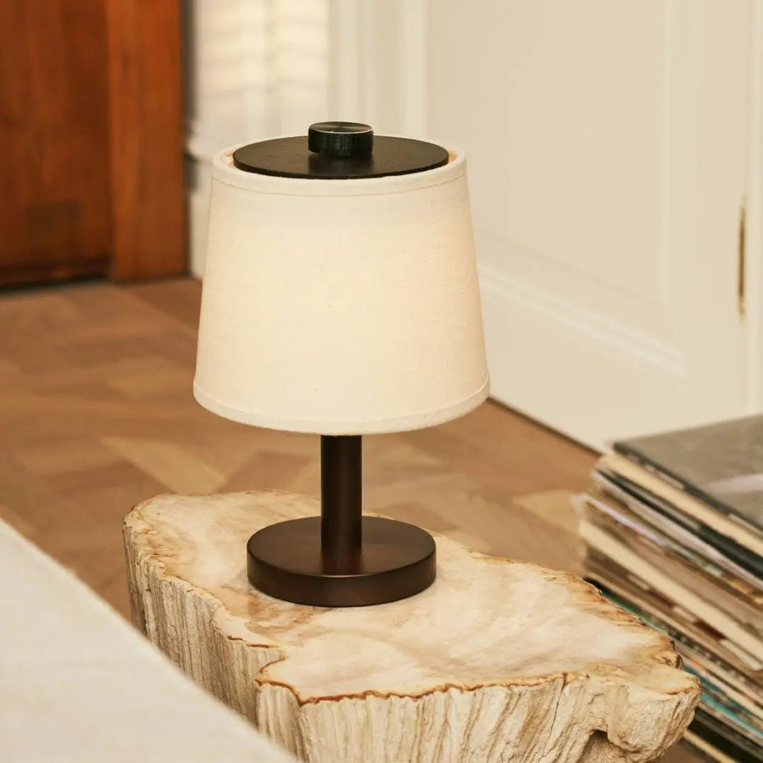 Rover cordless lamp side view showing dark rubberwood and linen shade