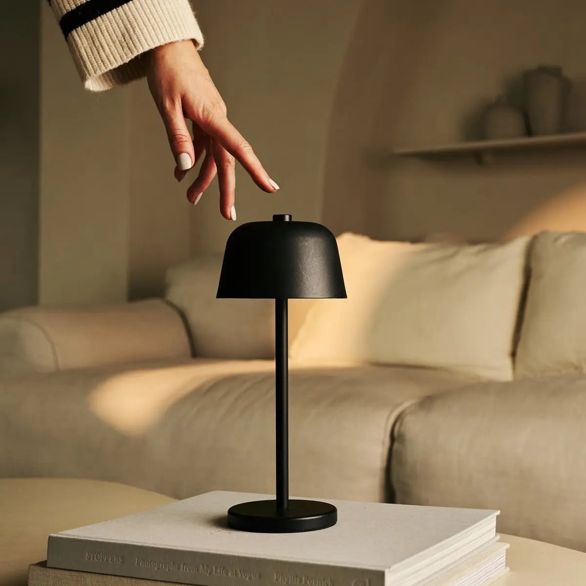 Bryn rechargeable lamp warm ambient glow on bedside table