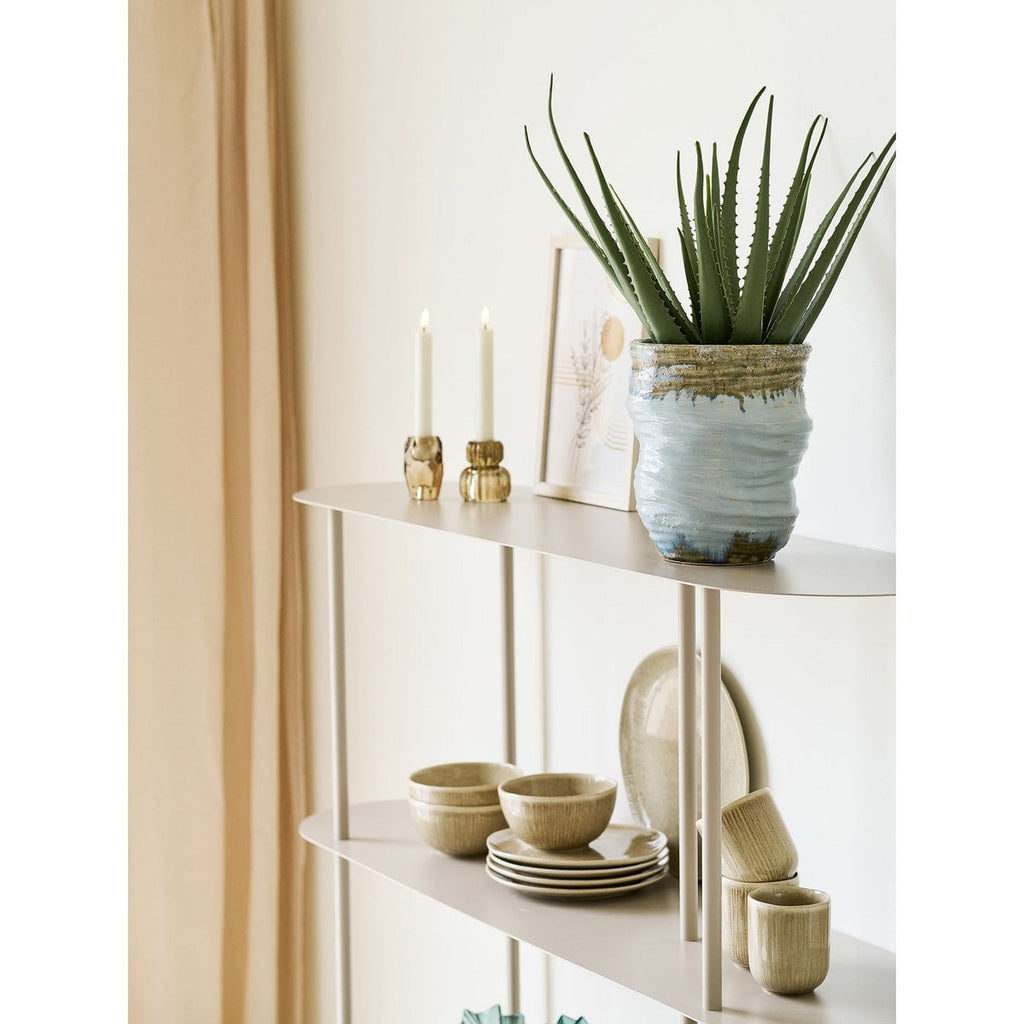 Azure Bloom vase side view showing smooth light blue form
