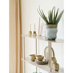 Azure Bloom vase side view showing smooth light blue form