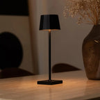 William rechargeable lamp warm ambient glow on bedside table