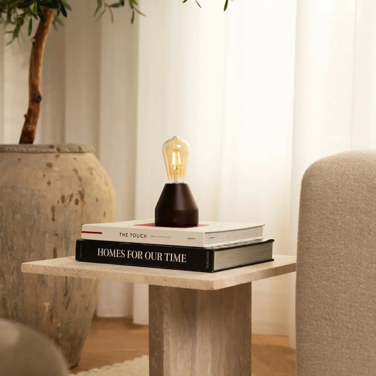 Zavi dark wood glass lamp on outdoor terrace