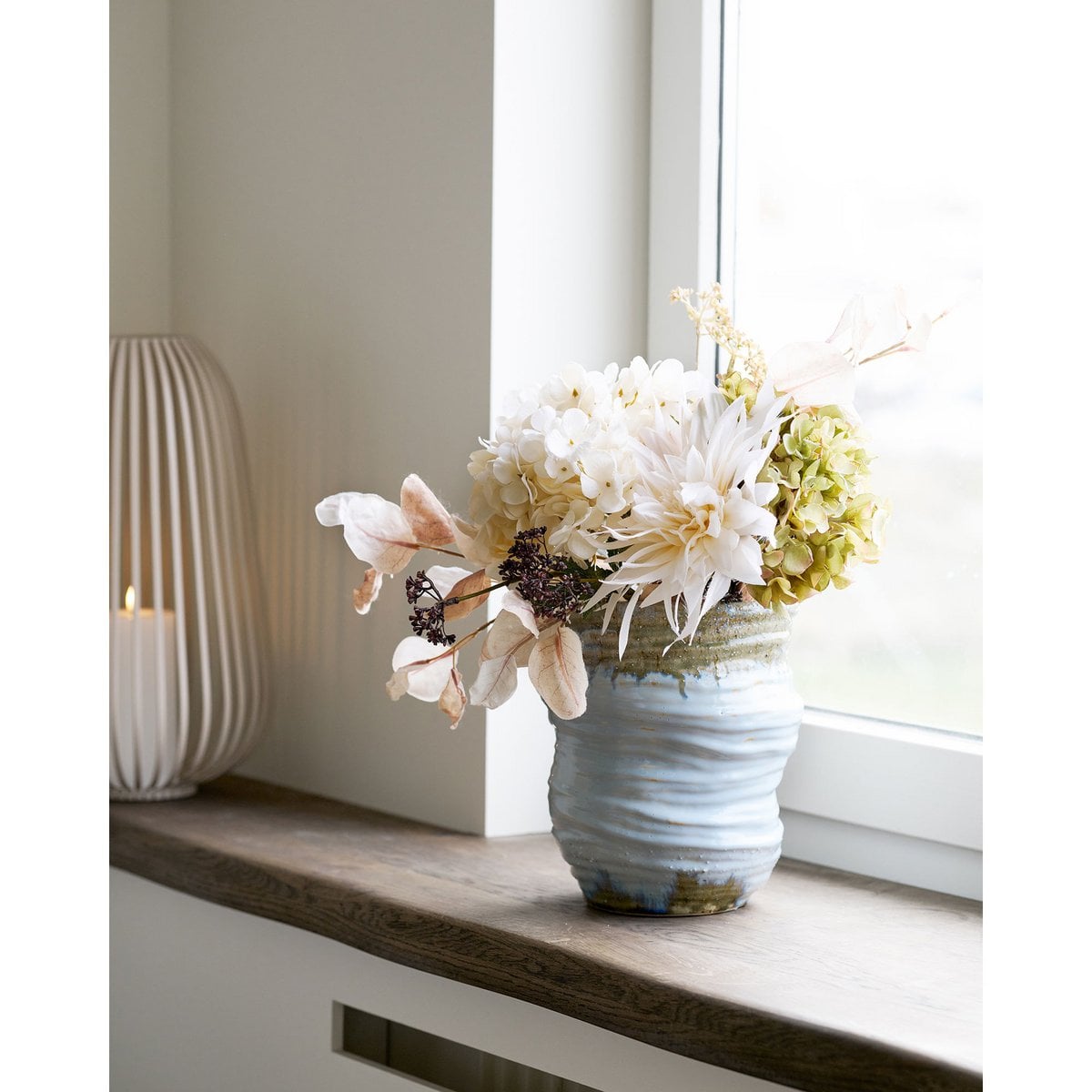 Azure Bloom light blue ceramic vase rounded silhouette