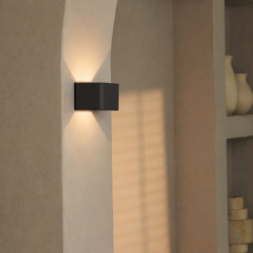 Tess wireless wall light mounted showing compact circular form